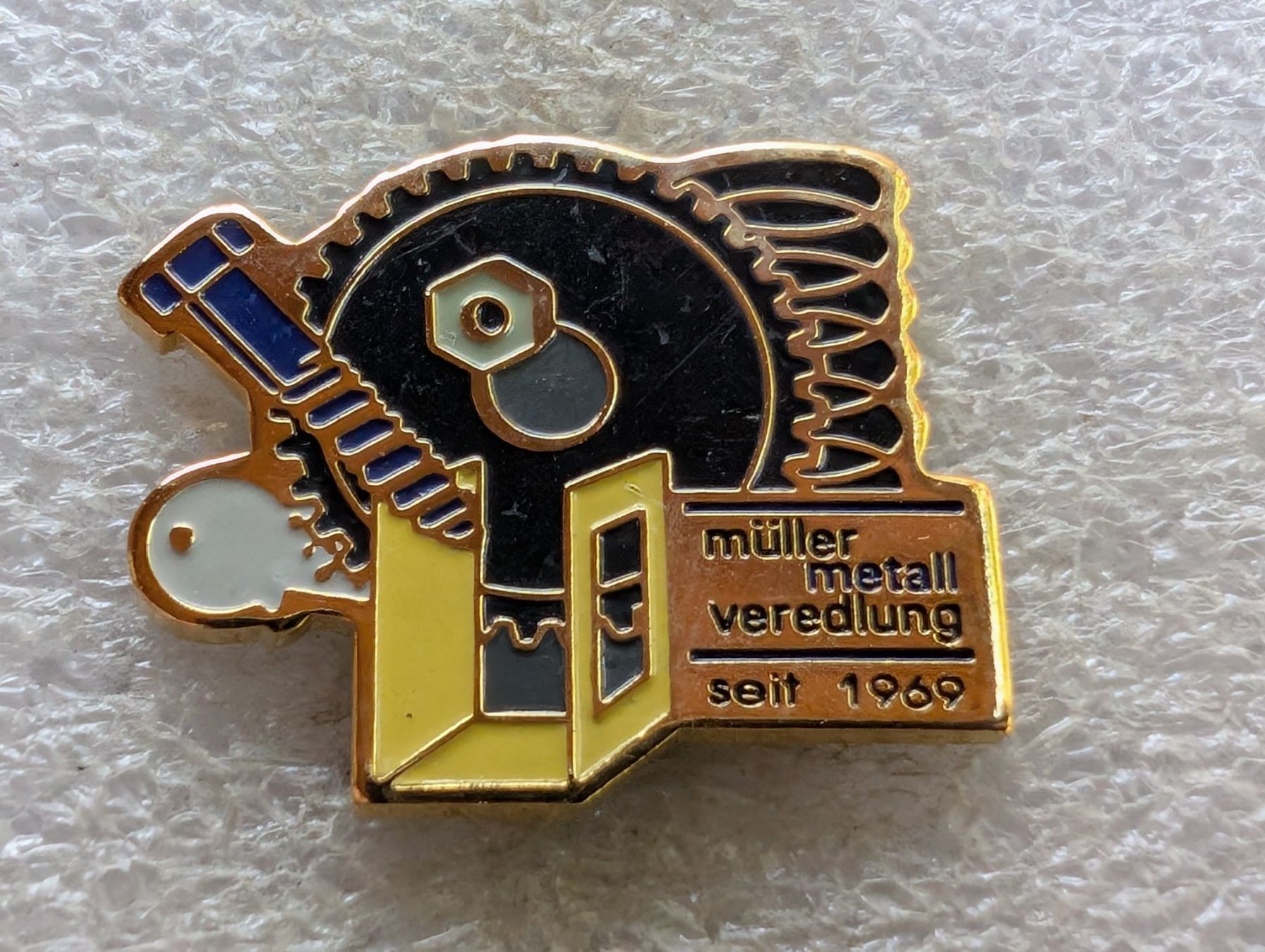 Plaketten & Abzeichen: Ansteckpin 192: Müller Metall – Gebraucht aus Oppligen von Pin-Fall-Shop