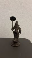 Bronze figure, possibly Ganesha, with umbrella