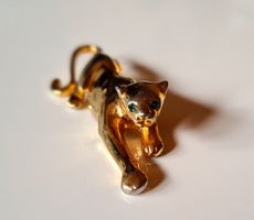 Modeschmuk Brosche Panther mit feurigen Augensteinen