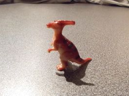 Dinosaurier, braun, schwarze Streifen, zwei Beine