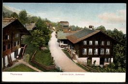 AK Leissigen am Thunersee, Dorfstrasse mit Bäumen