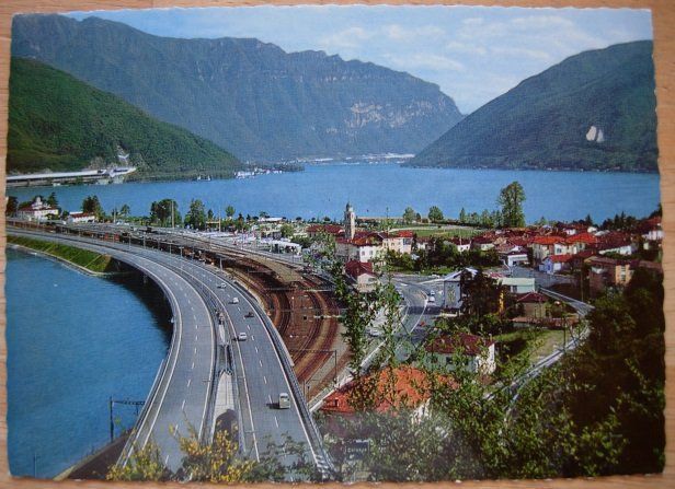 Cartoline postali: Ansichtskarte ungelaufen - Melide / Autostrasse über den See – Usato da Dübendorf venduto da rumpumpel