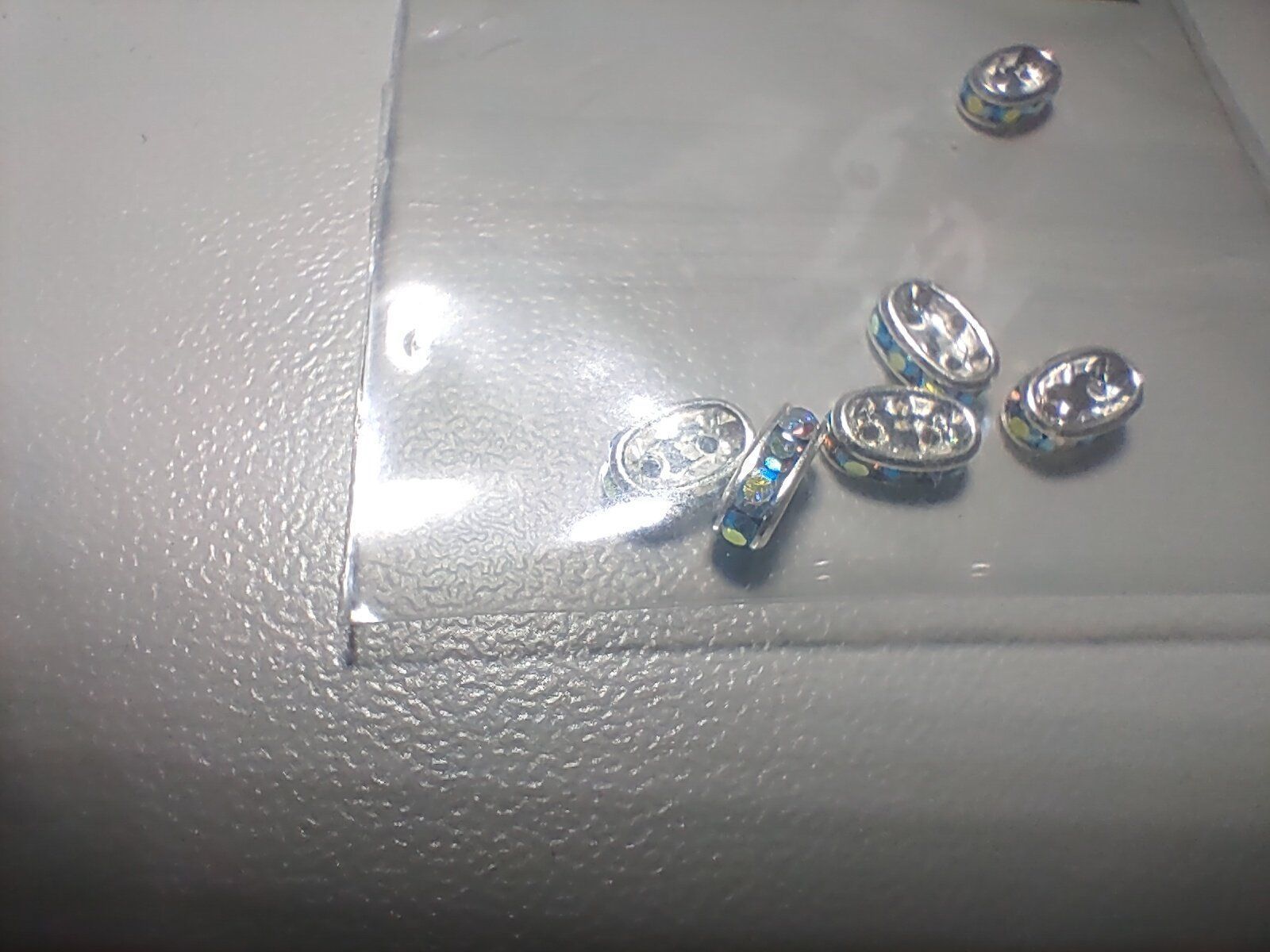 Perle (finte): Strassstein Rondell versilbert crystalAB Doppelloch Twin – Nuovo e nell'imballaggio originale da Thalwil venduto da ersteigerer