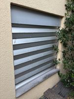 Elektrische(r) Sicherheitsfaltstore / Rollladen Stobag