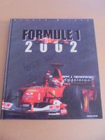 " Formule 1 2002 " par Arnaud Briand.112 pages. 28.5 x 25 cm