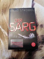 Der Sarg, Arno Strobel