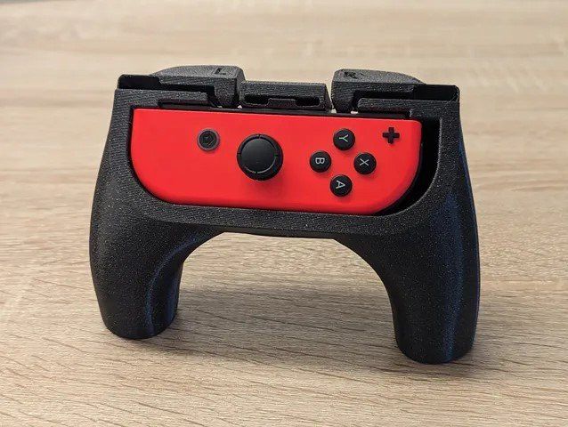 Nintendo Giochi: Ergonomische Joycon Griff Nintendo Switch – Nuovo e nell'imballaggio originale da Dietikon venduto da You_Want_We_Print