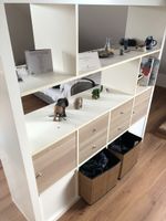 Bookcase with 4 drawers, 4 door-compartments and 2 baskets. 