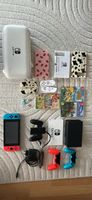 Nintendo Switch V2 + 3 jeux + nombreux accessoires 