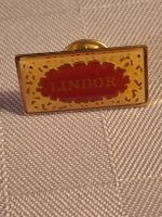Pin Lindor Logo goldfarben rot guter Zustand