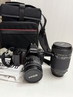 Appareil photo Nikon F-801s avec deux objectifs et sac
