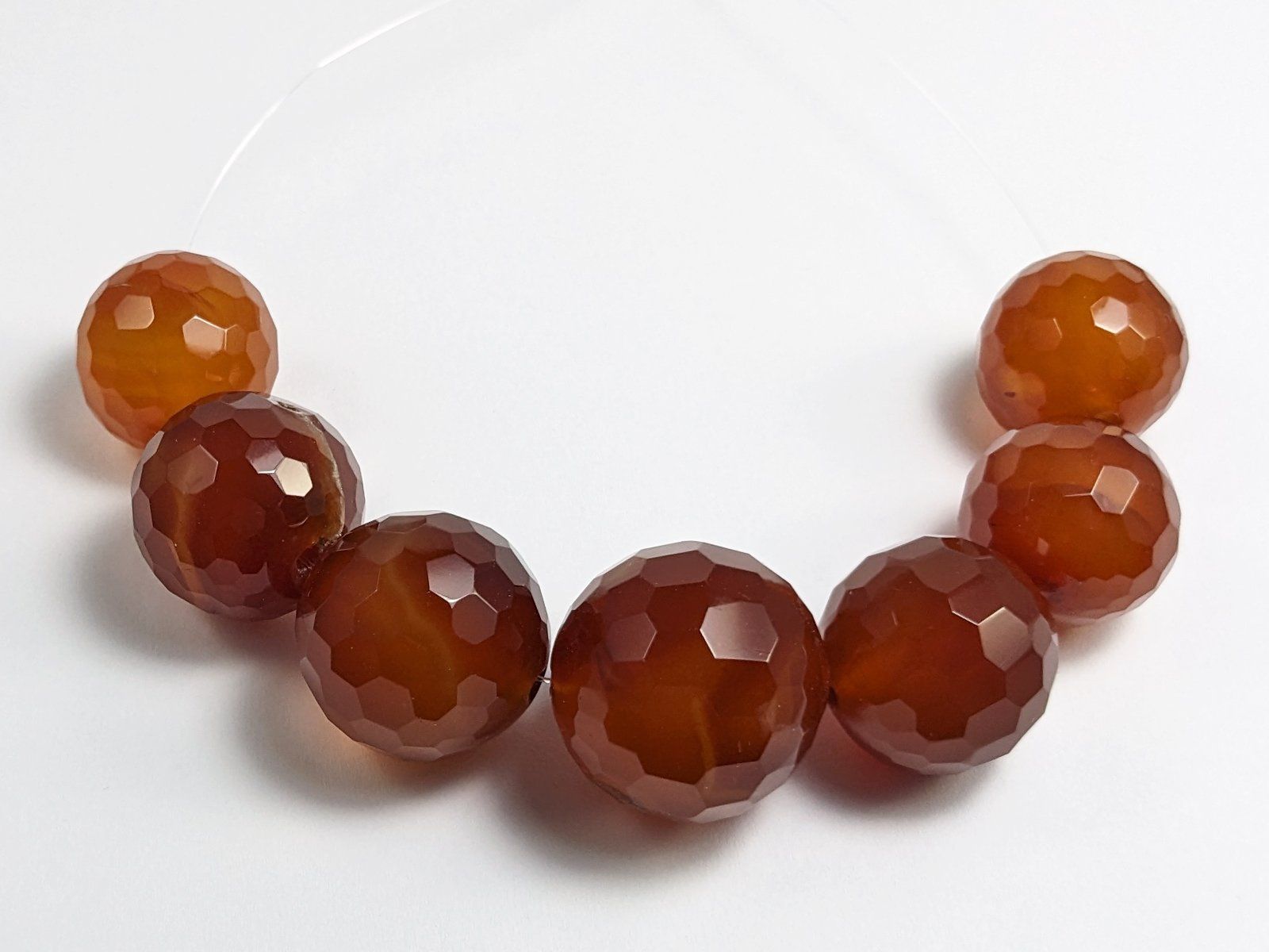 Minerali & Pietre curative: facettierte Karneol Perlen 20 bis 24mm, 7Stk – Nuovo e nell'imballaggio originale da Meilen venduto da GypsyCat