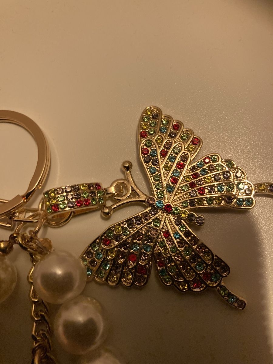 Portachiavi: Porte-clés papillon et tour Eiffel perles nacrées doré – Nuovo e nell'imballaggio originale da Plan-les-Ouates venduto da Namorona 1