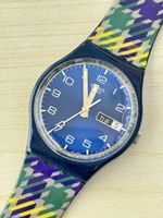 Swatch Armbanduhr blaues Zifferblatt gemustertes Band