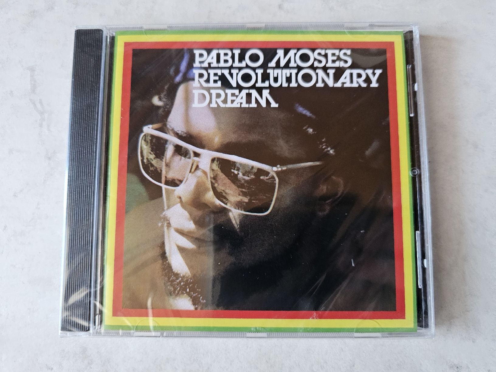 CD: Pablo Moses  -  Revolutionary Dream  /  Fabrikneu – Nuovo e nell'imballaggio originale da Schneisingen venduto da backstore24