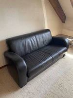 Schwarzes Sofa