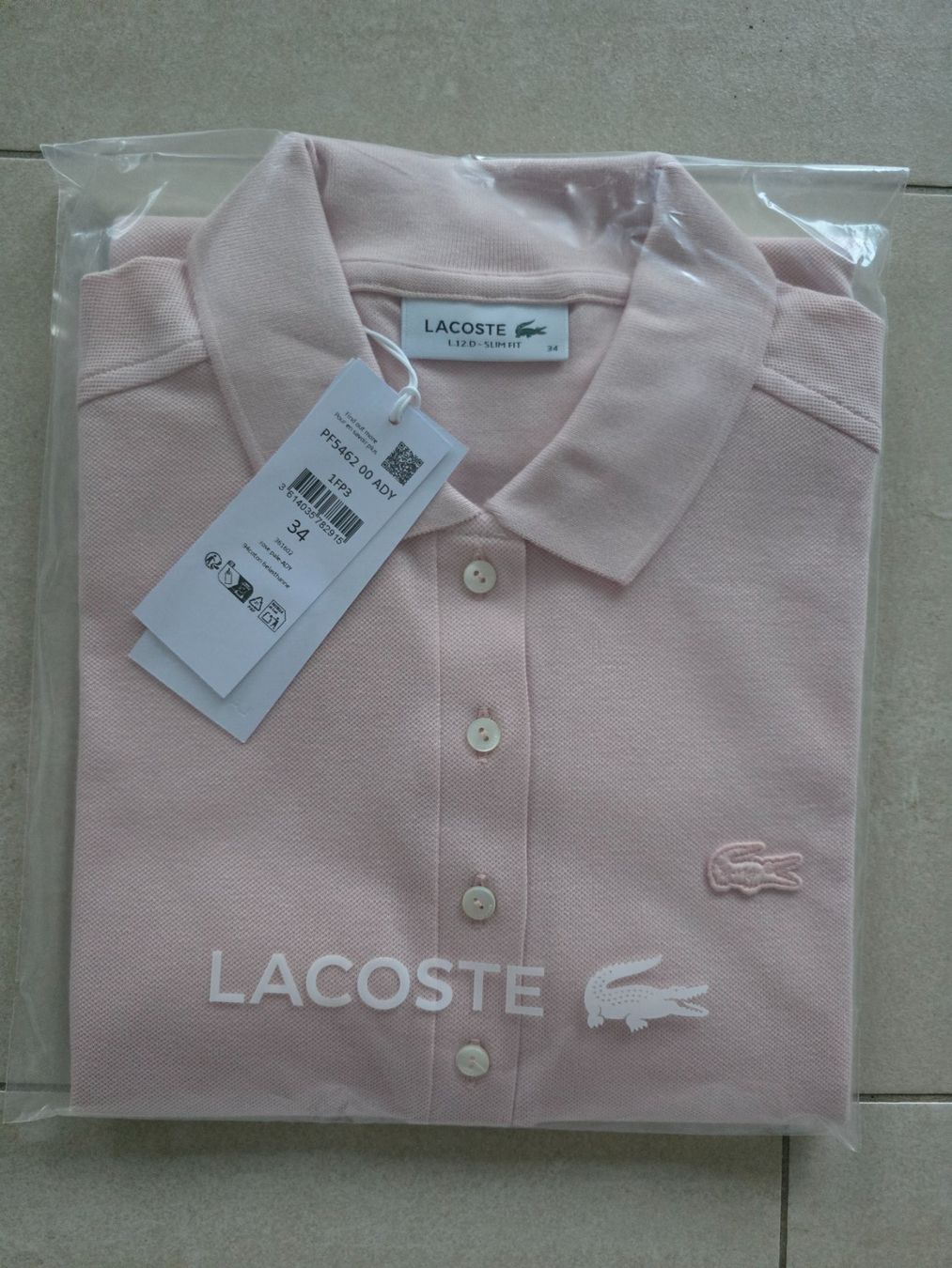 Lacoste Polo-Shirts: Rosafarbenes Lacoste Polo Gr. 34 – Gebraucht aus Steinhausen von aengeli07