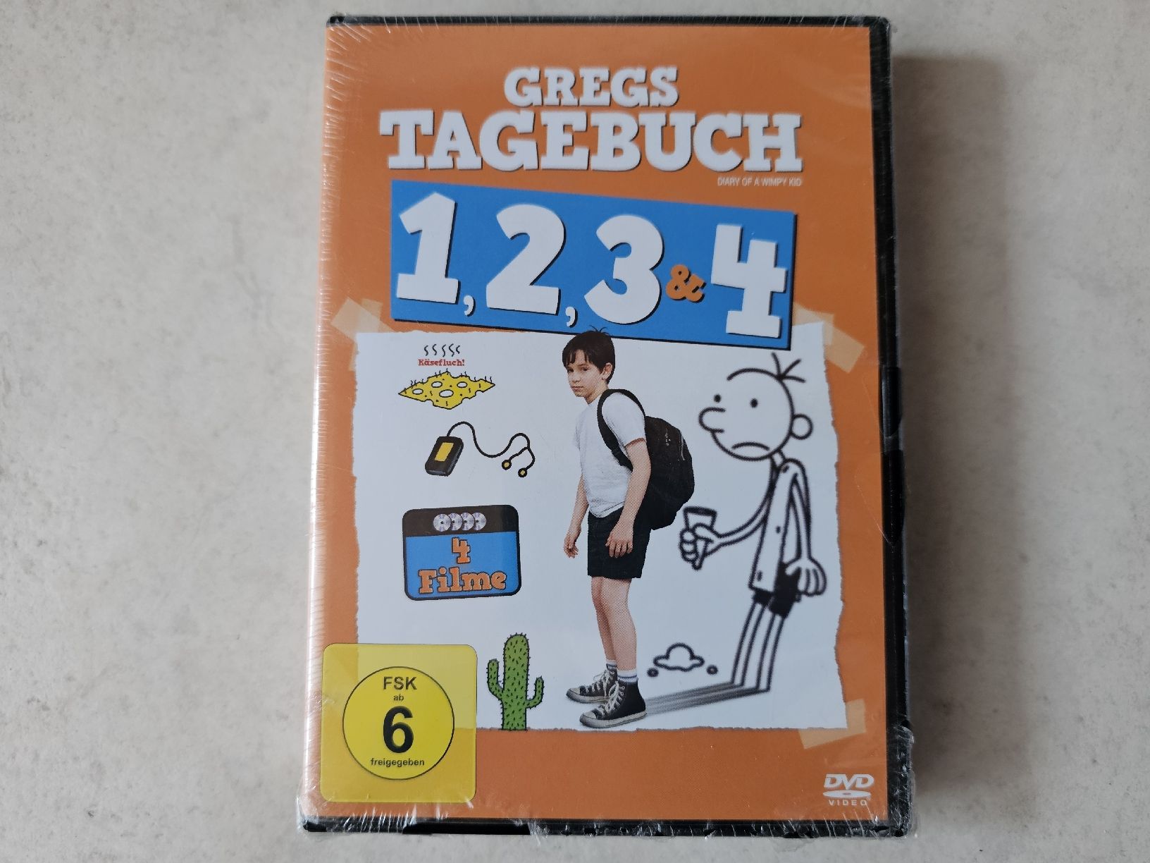 Tutti i DVDs: Gregs Tagebuch  -  Teile 1 - 4  /  Fabrikneu – Nuovo e nell'imballaggio originale da Schneisingen venduto da backstore24