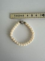 Armband mit Steinen und Stern mit Diamanten