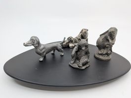 4 kleine Tiere vermtl. Zinnfiguren, Hase, Bär, Dackel, Hund