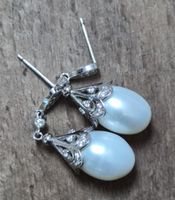 Elegante Ohrringe mit Süsswasserperlen und Zirkonia, Silber