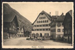 AK Wassen, Dorfplatz mit Säulendenkmal