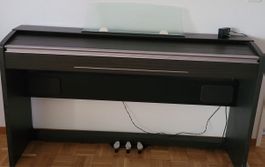 Digital piano dark wood colour..