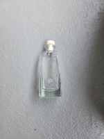 Bottiglia di vetro da collezione con tappo, vintage.