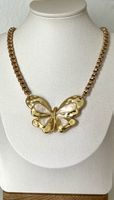 Gold-plated steel mother-of-pearl butterfly necklace.