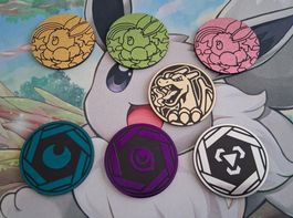 POKEMON coins 7 Stück.Eine ist mit Glurak:-)