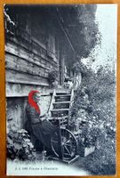 Champéry - Fileuse de Champéry avec son chat 1920