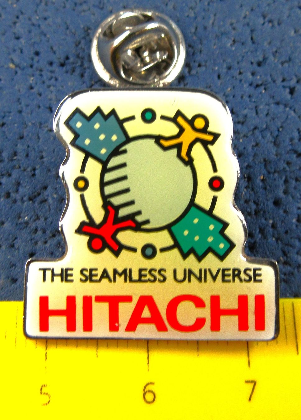 Plaketten & Abzeichen: HITACHI THE SEAMLESS UNIVERS POST PIN – Gebraucht aus Ettingen von Hausi4711