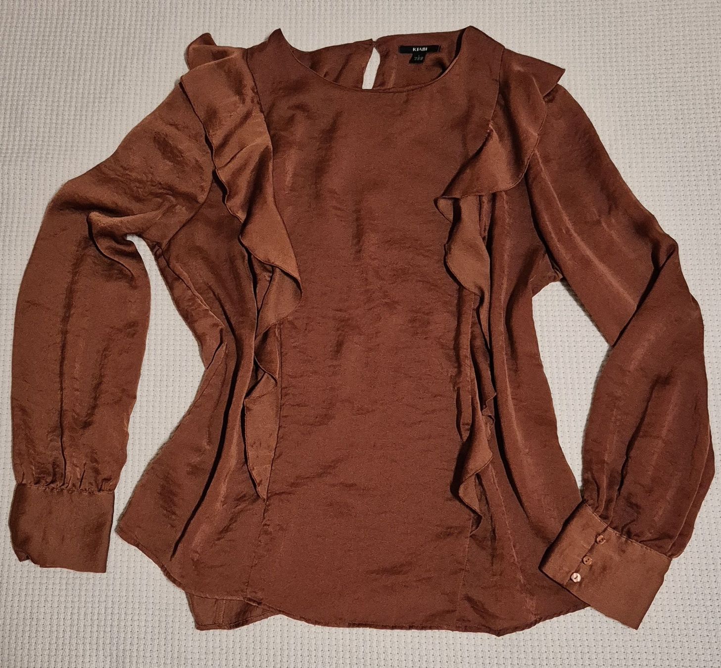 Blusen: Blouse Kiabi t. L avec volants élégant – Gebraucht aus Le Locle von Arya4