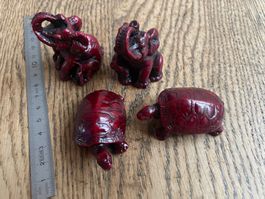 4 schamanische figuren: elefanten und schildkröten