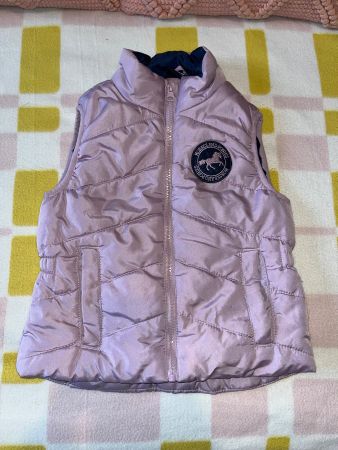 Lilac body warmer size 128 with horse logo