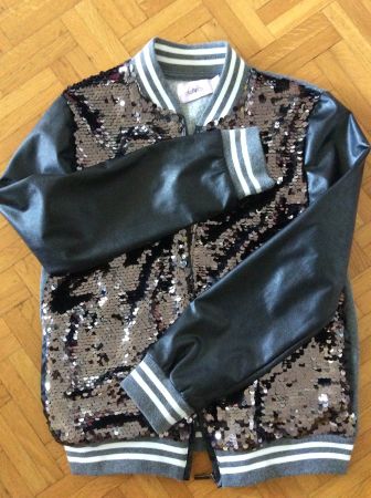 Veste à paillettes et manches en cuir synthétique taille 152