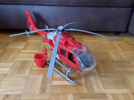 Spielzeughelikopter mit Wasserbehälter