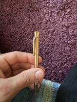 Drehstift „Tana“ goldfarben mit Muster gebrauchter Zustand
