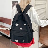 Schwarzer Rucksack mit Sternen