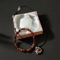 Bracelet en pierres naturelles avec pendentif dragon