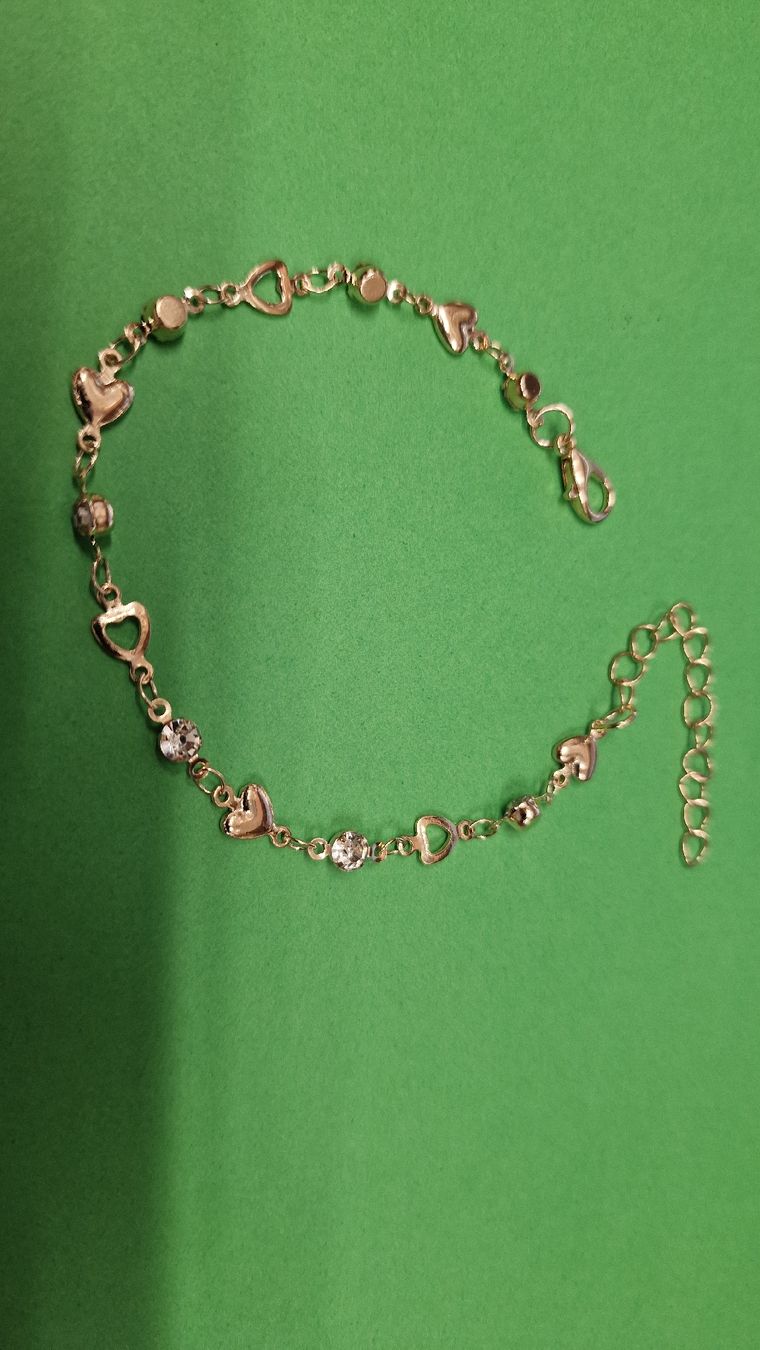 Bracciali & Braccialetti: Goldfarbenes Armband mit Herzchen und Glitzersteinen – Nuovo e nell'imballaggio originale da Herisau venduto da Antiques.AR