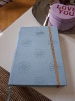 Cahier A5 bleu ciel marguerites ligné 