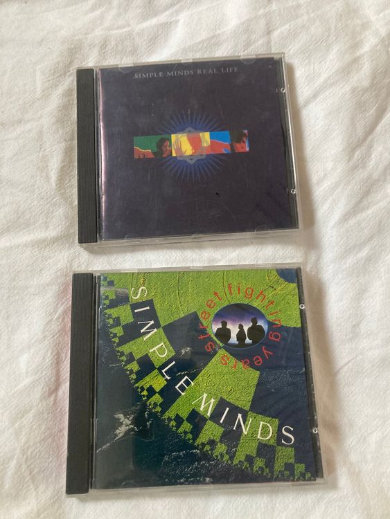 Simple Minds CD-Bundle - Real Life & Street Fighting Years (Gebraucht ...