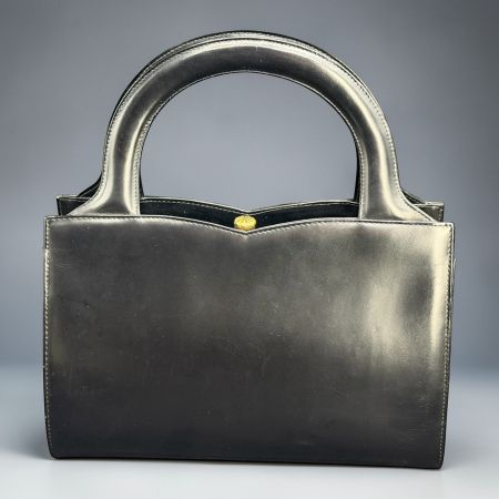 Sac à main LF AG en cuir noir. Swiss Made années 1960s