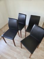 4 Esszimmerstühle schwarz Holzbeine