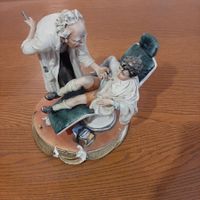 Porzellanfigur Zahnarzt mit Kind