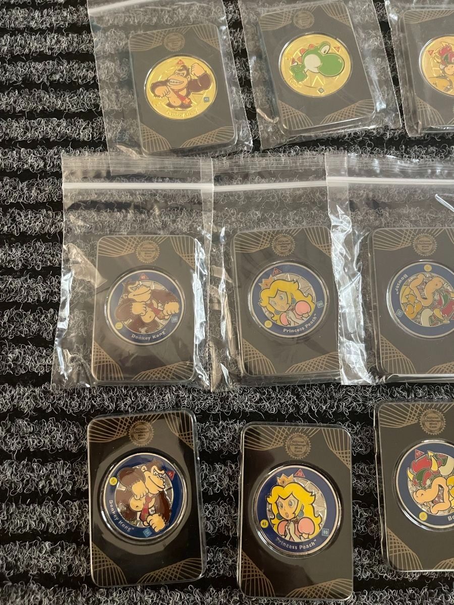 Tutti le monete: 18 Stk. Nintendo Super Mario Challenge Coins + Displaybrett – Nuovo e nell'imballaggio originale da Aesch BL venduto da CollectorsBest 5