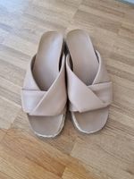 Flache Pantoletten beige