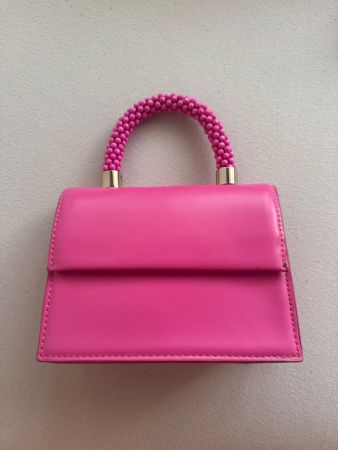 Sac à main rose avec poignée perles bon état 50 caractères