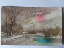 Alte Weihnachtspostkarte mit Winterlandschaft und Kirche